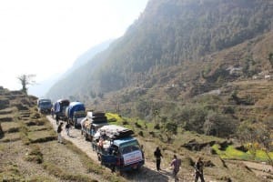 Trucks loaded with relief packages travelling in narrow hilly roads 2