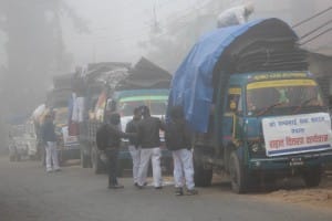 Trucks loaded with relief packages travelling in narrow hilly roads 3